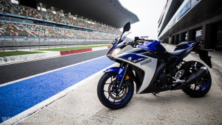 Motorcycle parked track stadium blue - a motorcycle free wallpaper