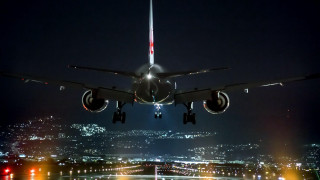 Jetliner night city lights flying - gear free wallpaper for desktop