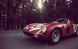 Red sports car forest city - the street in front free wallpaper for desktop