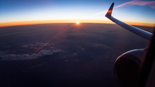Sunset over clouds airplane wing - eiq free wallpaper