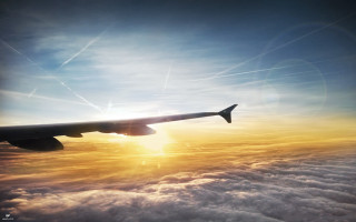 Plane flying clouds sunset sun - a plane free wallpaper