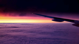 Airplane wing sunset clouds ocean - atmospheric free wallpaper