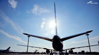 Jetliner airport tarmac blue sky 2 - cloud and sun free wallpaper
