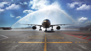 Jet airplane spraying water tarmac - a jet engine free wallpaper