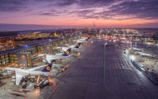 Large airport night time planes - a purple sky in the background free wallpaper for desktop