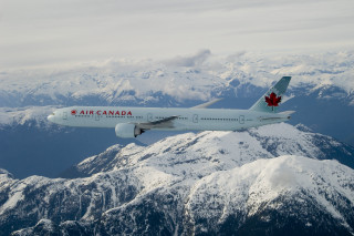 Canadian airplane mountain range snow - over a mountain range free wallpaper