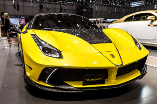 Yellow sports car showroom display - the background and people free wallpaper