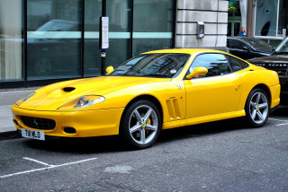 Yellow sports car parked road - a parking meter free wallpaper