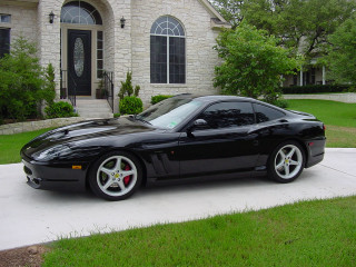 Black sports car driveway house - a black sports car free wallpaper