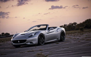 Silver sports car sunset cloudy - a parking lot free wallpaper